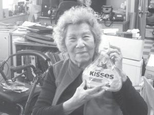 Ellen Olson with her “Kiss” prize from Carol Hackett.