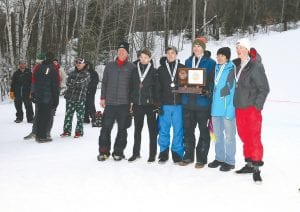 Accepting their medals and plaque for finishing third place at the state Alpine ski meet are from L-R Head Coach Charles Lamb, Masen McKeever, Will Surbaugh, Will Lamb, Ezra Lunde, Erik Lawler. Not pictured: Logan Backstrom.