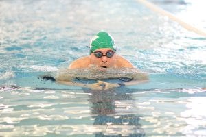 Working hard, Jeff Cadwell showed good form in the breaststroke portion of the 100-yard IM.