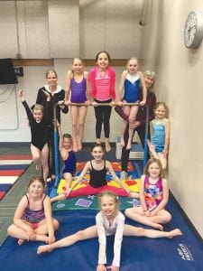 Gymnastics at the YMCA is in “full swing” and many winter session participants recently enjoyed building skills on the trampoline, vault, beam and tumbling mat during a sleepover at the YMCA on Friday, March 17. The next 10-week session begins Tuesday, March 28. Registration is still open. Gymnastics is coached by Jane Shinners, Sara DeWitt and Carin Gulstrand. Gymnastics participants include (back row from left) Ruby Law, Coach Sara DeWitt, Piper Sporn, MaTaya Fairbanks, Ella Hallberg, Coach Jane Shinners and Sofi Boen. In front, from left, are Hazel Liechty, Abigail DeWitt, Sophia Sheehan, Elizabeth DeWitt and Emma Boen.