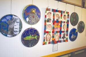 The Johnson Heritage Post recently opened a splendid new display of art and poems, with the main feature works created by fifth and sixth graders from Oshki Ogimaag elementary school in Grand Portage. Called The Seven Clans, the works are painted on circular/convex canvasses.