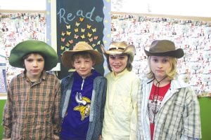 (L-R) Parker Backstrom, Jessen Conlan, Jordan Backstrom, and Danny Berka dress up in full Western regalia as part of their storytelling of the early pioneering days.