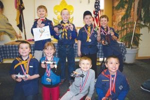 Cute cars and cute kids made for a great Pinewood Derby last Saturday. Kids showed great creativity in designing their cars not only for speed, but to give them pizzazz and panache. Top: Winners at the Pinewood Derby starting in front L-R: Lute Jansen, Lilija Smith, Liam Smith, Cullen Hall. Back row L-R: Rylan Brown, Ryden DeRosier, Landon Resler, and Noah Smith.