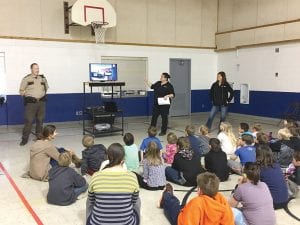 Cook County Sheriff Chief Deputy Will Sandstrom addressed a group of Birch Grove Elementary students last Monday and told them about the 911 system and how and when they should use it. Kids also got to look closely at a squad car and ask a lot of questions.