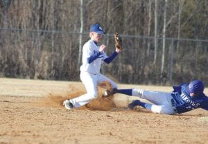 Top: Sliding hard into second base, Tristen Bockovich was safe on this play. Above: Showing good form, Josh Prom laid down a perfect bunt. Left: Ethan Sporn delivered some “heat” to the Mariner batter he faced in the sixth inning.