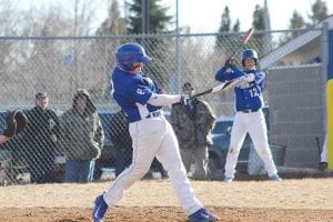 Top: Dillon Sjogren took a mighty swing and missed on this pitch with Colton Furlong (12) on deck. Above: Erik Lawler hustled hard to make a nice catch. Right: Joe Deschampe was ready to make a play at first base.