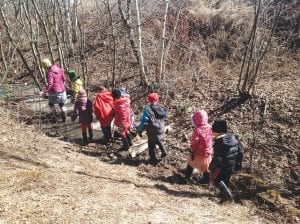 Recently the children put the boots to good use exploring the creek and cleaning up garbage revealed after the snow melted.