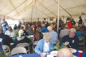 The tent at the Seagull Lake Community Center fit 167 people and all of the chairs were full for the meal and the speakers who followed. At least 40 people sat in chairs or on the lawn outside of the tent so they too could hear the presentation about the devastating Ham Lake fire that took place 10 years ago on the upper Gunflint Trail.