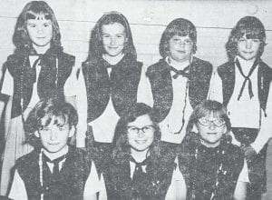 The fourth-grade group of Camp Fire Girls were presented with their Trailseeker Award at the Mother-Daughter Banquet held in May 1967 at the First Congregational Church. The girls each held a large replica of an honor bead and told what they had done to earn beads in the seven crafts. Pictured, front row from left, are Marilyn Sande, Gail Ansello, Ida Rae Van Buskirk; in back row are Robin Smith, Mary Johnson, Kathy Larsen and Lori Garner. The awards were presented by Mrs. Rolf Skrien, guardian of the group.