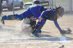 Scrambling hard, Alyssa Spry made an athletic play at her catcher position to tag out the Two Harbors Agates runner trying to come home.