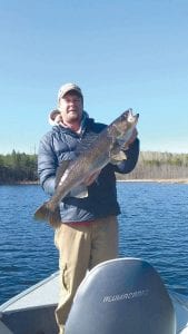 Cory Christianson caught and released this 31-inch walleye on Saganaga on Saturday, May 13, the Minnesota fishing opener. Fishing was slow, said Cory, with the smaller walleyes not taking the bait, but this trophy walleye made up for it. And while the walleye bite was slow, the trout were a better bet to fish and catch on the opener.