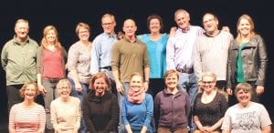 Above: The talented cast of the Grand Marais Summer Theater Festival is getting ready to perform for audiences all summer long. Back row, from left, are Gary Latz, Kate Fitzgerald, Diane Stoddard, Mark Abrahamson, Thomas Stamps, Jane Gellner, John Bragstad, Kevin Kager, Hilja Iverson. Front row from left, Carrie Nath, Jan Healey, Karen Blackburn, Rose Arrowsmith DeCoux, Karina Roth, Aliya Marxen, Sue Hennessy. Not pictured are Susan Bragstad, Sam Seitsema and one more guy. Left: Sue Hennessy, right, welcomes visiting Theater Artist Carrie Nath to the Grand Marais Playhouse.