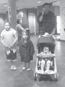 Above: ENP Cook’s Helper Cedar Denny at Pow Wow with his family, Alexis, Jade and Francis. Left: Elder Pow Wow winner Agatha Armstrong with her winning tickets.