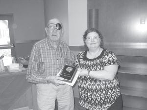 Nora Bockovich presented Walt Mianowski with a plaque honoring him for over 30 years of volunteer service at the Care Center during the Volunteer Brunch.