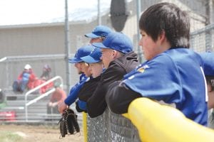 While the varsity baseball team took the field in a recent home game, the younger JV players watched intently, cheering their teammates on and dreaming about their chances to play varsity baseball.