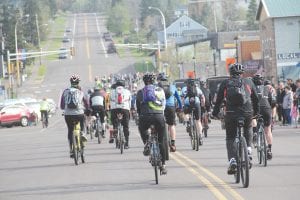 And they are off! Competitors in the Le Grand du Nord 100-mile bike race on Saturday rode off into the early morning sunshine, each carrying the supplies they would need in the race. No outside help was allowed, so riders were on their own. See more about this race on page B1.