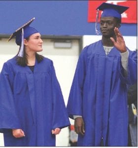 Left: As the band played Pomp and Circumstances” the class of 2017 entered and took their seats. Here Brooke Sherer and Sam O’Phelan walk to the front of the room. Above: Marin Hay was this year’s salutatorian.