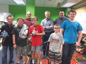 Pictured here are the coaches and top players in the Sawtooth Elementary and Middle School chess tournament that was held at the end of the school year. In front, from L-R: Tate Crawford, champion; Andrew Hallberg, coach Sam Kern, Caden Spry, Adrian Howard-Larsen. Back row L-R: Jeff Kern, Mike Carlson, and Assistant Principal Bill DeWitt.