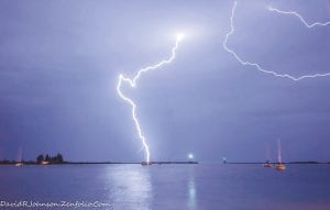 June has been stormy, wet, and wild. Noted outdoor photographer David Johnson took this electrifying picture of lightning over the harbor last week. Cool temperatures and rain seem to be the staple for most days recently, but the caveat is when lightning knifes through the darkness and fills the sky with ribbons of astonishingly bright white light. It is like all of the stars were gathered together and their light hurled to earth in violent thrusts.