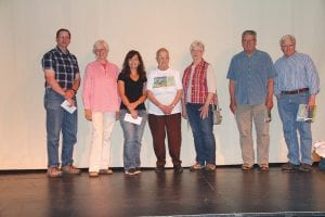 On hand to receive checks from Operation Round Up for the organizations they represent were, L-R: Peter James, Great Expectations School; Ann Mershon, Art ’Round Town; Sissy Lunde, Community Education; Eleanor Waha, Cook County Historical Society Museum; Suzan From, Schroeder Historical Society; Karl Hansen and Paul Nelson, Oral Task Force.