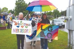 Despite the rain, at least 87 people turned out for the Equity March for Unity and Pride in Grand Marais last Saturday. Marches were held around the country to promote support and to bring attention to those in the community who are targeted due to immigration status, ethnicity, skin color, gender, and disability. The sign carried by this marcher said it all, “Welcome Neighbors!”