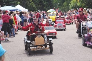 How big has Tofte’s Fourth of July celebration become? Thousands gathered for the parade and all-day festivities, which included games, a trail race, and activities aimed at all ages. There was music, refreshments sold by the Tofte firefighters, and the evening ended with fireworks over the lake. Above, one of the fan favorites was the little cars driven by the Lakehead Shriners of Thunder Bay. See more of the Tofte 4th of July celebration on page A3.