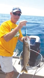 Left: Derek Bronson, Litchfield, Minnesota used a Beaver Flick to catch this lake trout. He was also a customer of Captain Kelly Shepard.