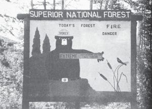 The fire danger was extremely high in the early summer of 1997, as evidenced by this old-fashioned Smokey Bear sign in the Superior National Forest outside of Grand Marais. The signs were changed daily to alert campers and hikers when conditions call for extra caution, but as the Herald observed, “the signs seem stuck on ‘extreme.’” In fact, the Forest Service said the preceding two weeks were hotter and drier than during the same period in 1996 and 1995— both years that produced extremely serious fires.