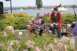 When it was their turn to play, Briand Morrison and Roxanne Berglund filled Grand Marais Harbor Park with music during the Grand Marais Arts Festival.