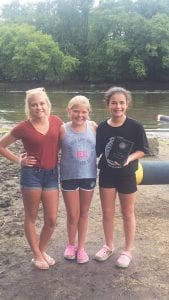 Three YMCA North Shore log rollers traveled to Onalaska, Wisconsin to compete in the Three Rivers Roleo log rolling competition and all did well. From L-R: Paige Everson, Taylor Everson and Ali Duclos, proudly holding the first-place plaque she won in the girls’ U-10 division.