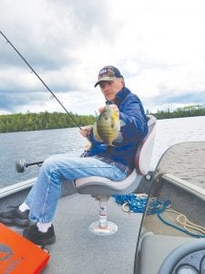 Left: Dale Gervais, Maplewood, found the sunfish to be a lot bigger in Cook County than in the Twin City metro lakes.