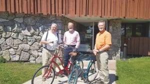 In front of the First Congregational Church in Grand Marais WOW representatives reviewed two donated bicycles for possible loan to the international workers. Pictured from left to right: Dan Strayer, Steve Deschene, and Jerry Lilja.