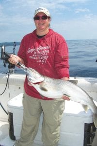 While it’s true that fishing has been picking up with more fish being caught, that doesn’t mean one is likely to catch a fish as big as Shannon Rising’s 18-pound, 33-inch lake trout she reeled in while fishing with Captain Darren Peck of Tofte Charters. Rising, from Minneapolis, caught this beauty on Tuesday, July 18 somewhere in the Big Lake.