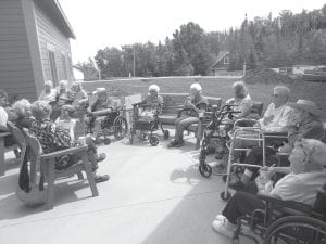 It was a gorgeous day on July 21 when a large group of residents gathered on our new patio for Current Events with Tina Krauz. Thanks to Susan Scherer for making the planter box for our new outdoor space.