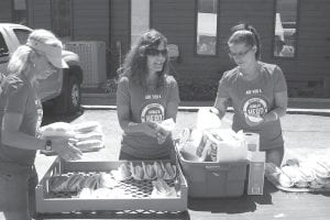 The North Shore Federal Credit Union held its Annual Member Appreciation week recently. Serving up hot dogs and brats were, from left, Tanya Eliasen, Sissy Lunde, and Emily Arnold. Over the course of a week drawings were held for prizes, and someone who took part in Hunger Heroes won $500. Donations to Hunger Heroes raised $6,900 for July. Those funds are distributed to Ruby’s Pantry, the Kids Backpack Program and the Cook County Food Shelf. All of the North Shore Federal Credit Union locations (Two Harbors, Silver Bay and Cook County) took part in the Hunger Heroes program.