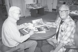 Bob Pratt (L) and Rick Anderson were two of many who attended the Old Timer’s Gathering at 10 a.m. on August 4th at the Cook County Senior Center. Scrapbooks filled with pictures of people and places from years gone by were laid out on tables and perused by the folks who showed up to remember and reminisce about days past.