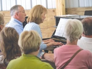 Nancy and Hugh Magill played piano together in their performance of Johannes Brahms waltzes from Neue Liebeslieder, Opus 65a.a