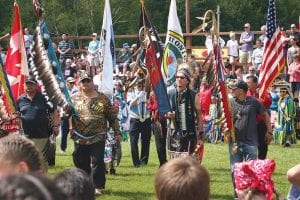 Following the Grand Entry veterans carrying flags of their tribes and country were honored for their sacrifices at the Grand Portage Pow-Wow. All told there were 22 drums that came from Thunder Bay, Northern Ontario, Minneapolis, Leech Lake and many other places in Minnesota to take part in the three-day festival held August 11-13. The Grand Portage Traditional Pow-Wow had 387 registered dancers. More on pages B4-B5.