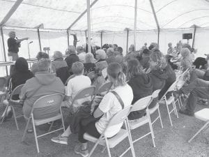 With a tent full of anxious buyers, Michael Valentini, pointing a finger at a bidder, was the “caller” for the Mid-Trail auction held Wednesday, August 9. Between the auction, flea market and boutique, $13,000 was raised from sales and donations for the volunteer Gunflint Trail Fire and Rescue Department.