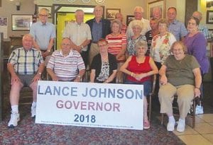 Standing in the middle of the back row wearing a dark sweater, Lance Johnson announced to his fellow high school classmates that he was throwing his hat into the governor’s race. Johnson made his announcement in Zumbrota at his 60th high school class reunion.