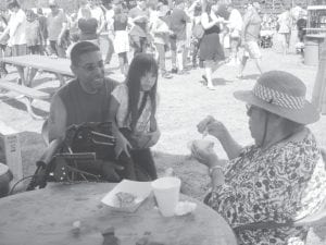 Doris Blank enjoys her strawberry shortcake while visiting with her nephew, Bill, and grand-niece.