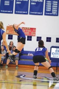 Left: Sela Backstrom goes high into the air before spiking the volleyball in the match against the Marshall Hilltoppers. Top: Sophie Eliasen made a nice play to dig this ball off of the floor. Above: Wearing the libero white shirt is Hanna Borson, who bumped the ball to her front line.