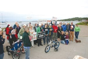 In the wake of the racial violence and death that occurred recently in Charlottesville, North Carolina a group of about 50 people gathered at Harbor Park in Grand Marais on Saturday, Aug. 26 and conducted a Charlottesville Vigil. The vigil was called by Spirit of the Wilderness Church, Congregational Church, and Arrowhead Indivisible. Attendees gathered to “reaffirm our community’s commitment to peace and love.”