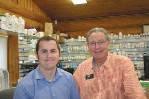 If you need a prescription filled, A.J. Cox (left) and Bob Sample are ready to go to work for you. A.J. just moved to Grand Marais from Wyoming to work for Sample.