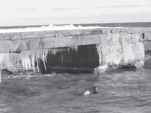 It was a wee bit colder when this picture of the crumbling Hovland Dock was taken, but it is easy to see that the dock is falling apart. As the last remaining dock of its kind on the Great Lakes, efforts are under way to save the structure. The dock was built in 1905 and served as a hub for local transportation and was in use until commercial fishing fell off due to the lamprey killing the lake trout.