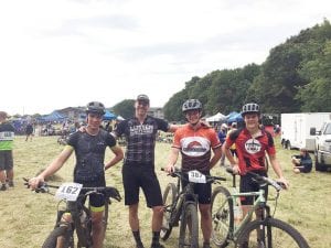 Members of the new Cook County high school cycling league are L-R: Will Surbaugh, Lutsen 99er Race Director Peter Spencer, Leif Anderson and Henry DeArruda-Weaver.