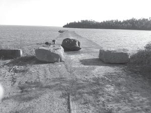 Because vehicles had been driven onto the Hovland dock the highway department was asked by Cook County Land Commissioner/Parks & Trails Director Lisa Kerr to put three boulders in front of it to block any more traffic on the crumbling structure. The boulders were placed there during the first week of September.