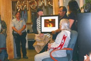 Nature Conservancy representative Pat Ladner presented Grand Portage tribal chairman Norman Deschampe with a picture of Susie Island to commemorate the Conservancy’s giving Susie Island back to the Grand Portage Band of Lake Superior Chippewa. The Conservancy has been working for more than a year with Grand Portage on this transfer of land.