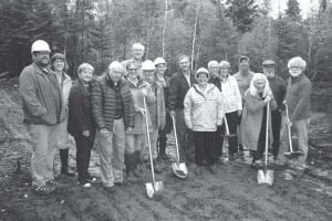 Attending the Monday, October 2 groundbreaking ceremony for the Nordic Star Affordable Housing project were, from R-L: Cliff Knettell, Jennifer Stoltz, Pat Campanaro, Hal Greenwood, Julie Petrusha, Howard Hedstrom (in back), Carol Mork, Heidi Doo-Kirk, Randy Lasky, Mary Somnis, Myron Bursheim, Ginny Storlie, Jay Arrowsmith- DeCoux, Jan Sivertson, Jim Boyd and Tim Kennedy.