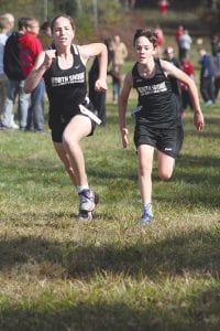 Left: Cecelia Chmelik and fellow North Shore Storm middle school runner Tristen Surbaugh battle to the finish line. Cecelia placed third in the girls’ race while Tristen was 24th among boys competing in the middle school division. Above left: Noah Smith passed people the whole race and nearly beat Moose Lake’s Ethan Olson, who placed fifth at state last year. The sophomore from Two Harbors was only 10 seconds behind Jake Paron, who won the race. Above right: Chloe Blackburn (left) and Robin Henrikson finished in seventh and eighth place in the junior varsity girls’ race.